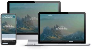 A laptop, phone and tablet displaying a mountain website design.