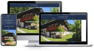 A mobile phone, tablet, and laptop with a website for a chalet.